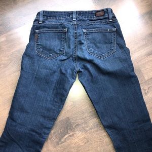 Dark wash Paige straight leg jeans in size 25.